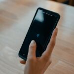 person holding black android smartphone