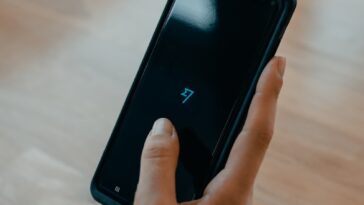 person holding black android smartphone