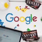 photo of M&M forming Google chocolate candies on table