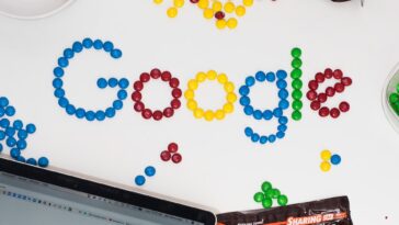 photo of M&M forming Google chocolate candies on table