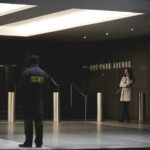 security guard standing on the gray floor