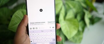 a person holding a cell phone in their hand