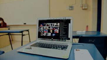 macbook pro on blue table