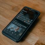 black android smartphone on brown wooden table