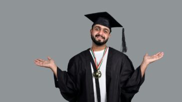 a man wearing a graduation cap and gown