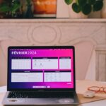 a laptop computer sitting on top of a table