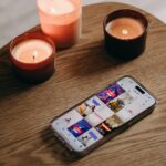 a cell phone sitting on top of a wooden table