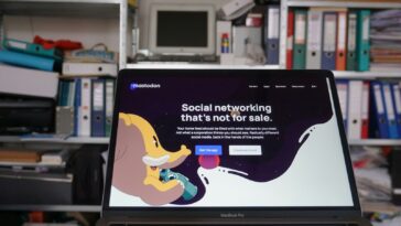 a laptop computer sitting on top of a desk