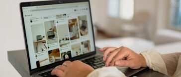 a person using a laptop computer on a desk