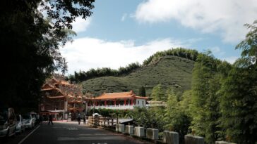 a street with a hill in the background