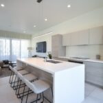 a kitchen with a refrigerator freezer sitting next to a counter