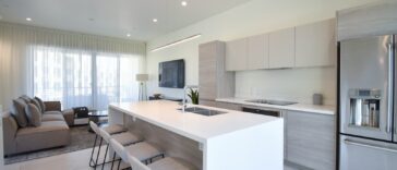 a kitchen with a refrigerator freezer sitting next to a counter